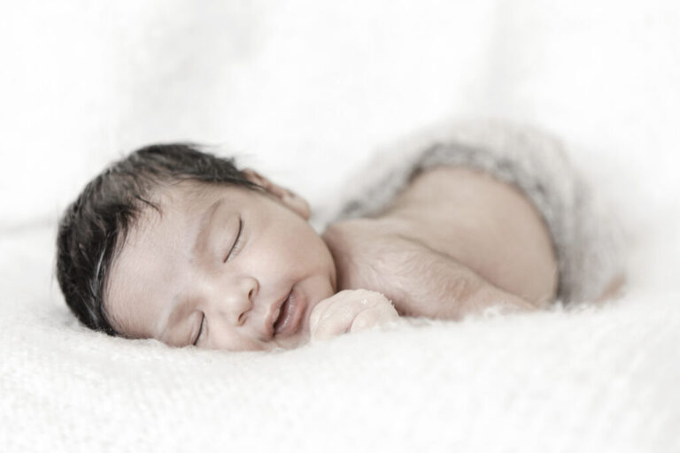 Newborn Photographer Loughton. minimal and timeless newborn photography, baby boy photographed in studio in white background with no props, by petite feet photography in Woodford East London