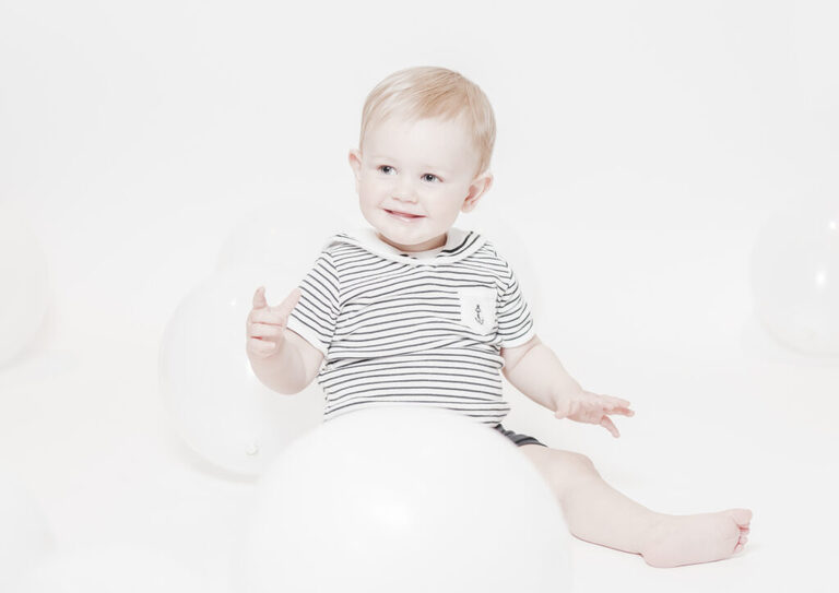 Baby Milestone Photography Epping. minimal, bright and airy first year birthday photography of baby boy on white background