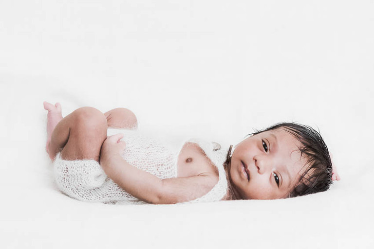 Epping Newborn Photographer.Why I do what I do. Newborn baby boy photography in home studio set up, no props, white background, minimal and timeless newborn photography, Woodford, London, West Essex by petite feet photography