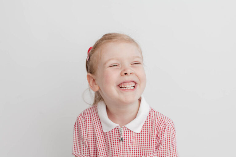 contemporary school photography London, contemporary preschool portrait with white background and natural studio set up by petite feet photography
