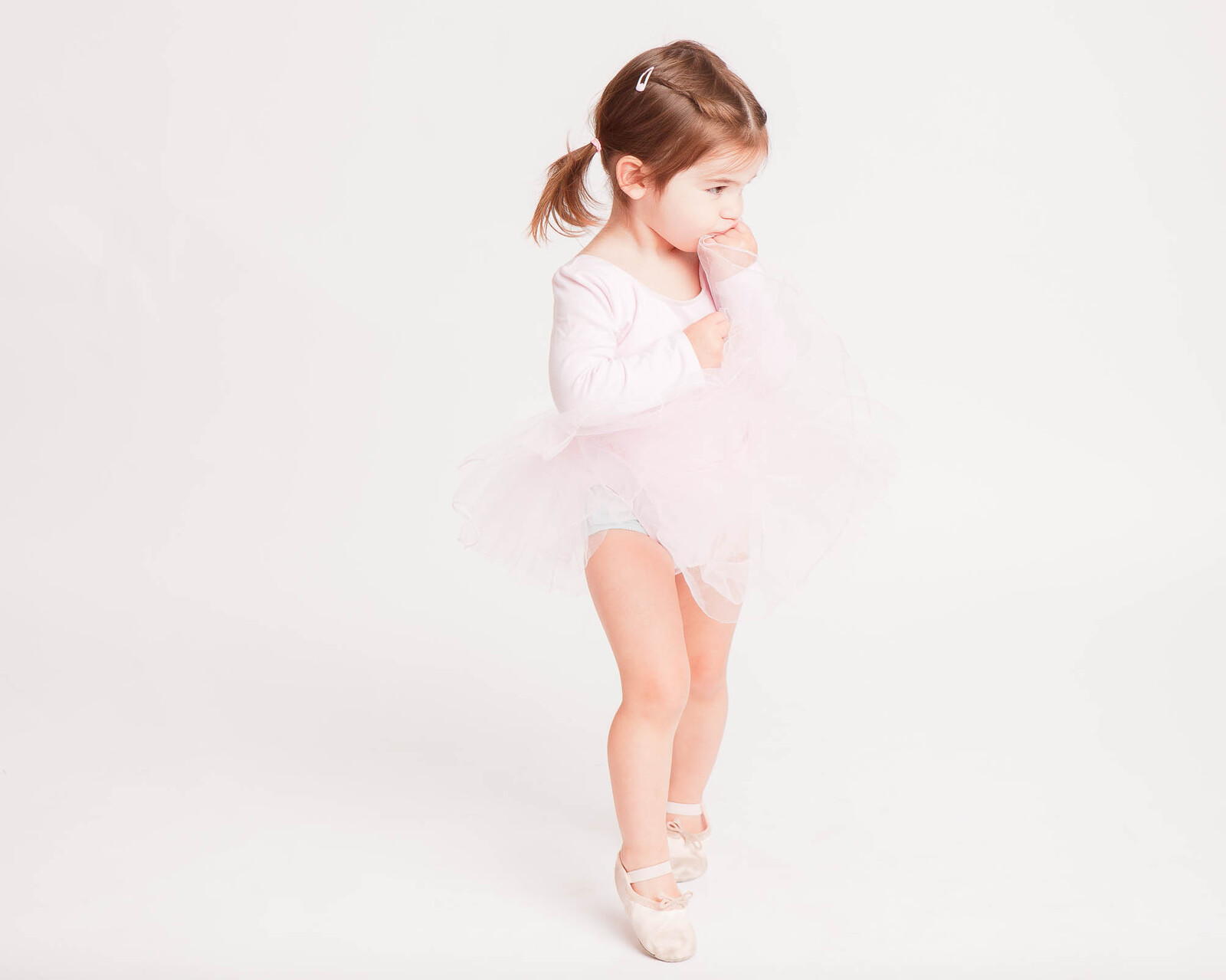 baby ballerina studio photography with white background and pink tutu shot by petite feet photography, children London photographer in Woodford, West Essex.